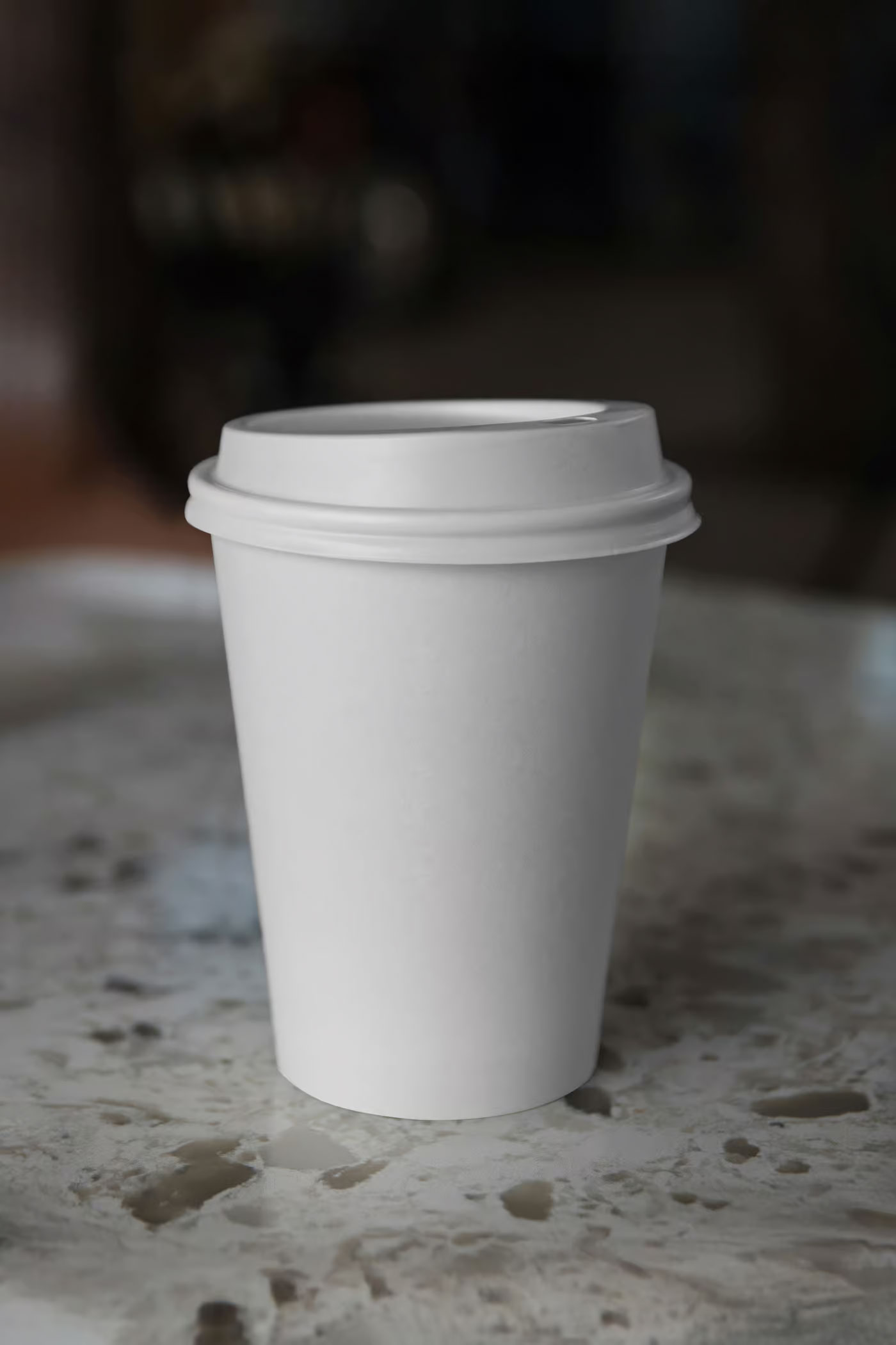 Free Coffee Cup on Countertop Mockup PSD Template