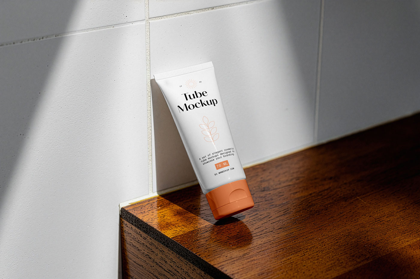 Free Cosmetic Tube Leans Against Wall Mockup PSD Template