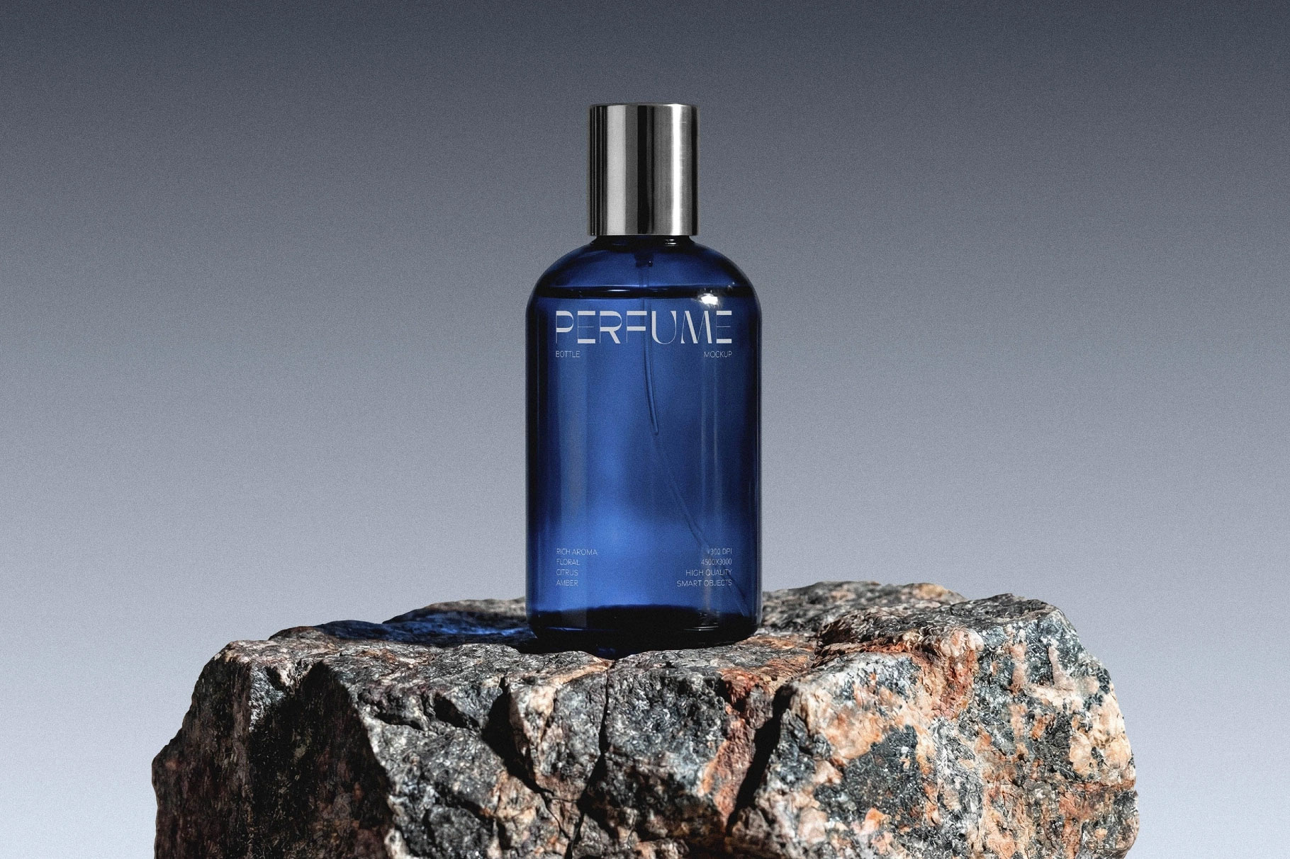 Free Glass Perfume Bottle Mockup on Stone PSD Template