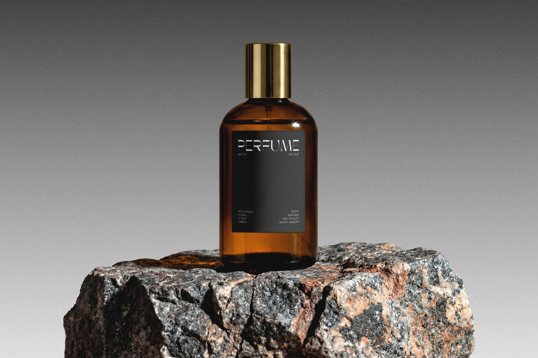 Free Glass Perfume Bottle Mockup on Stone PSD Template