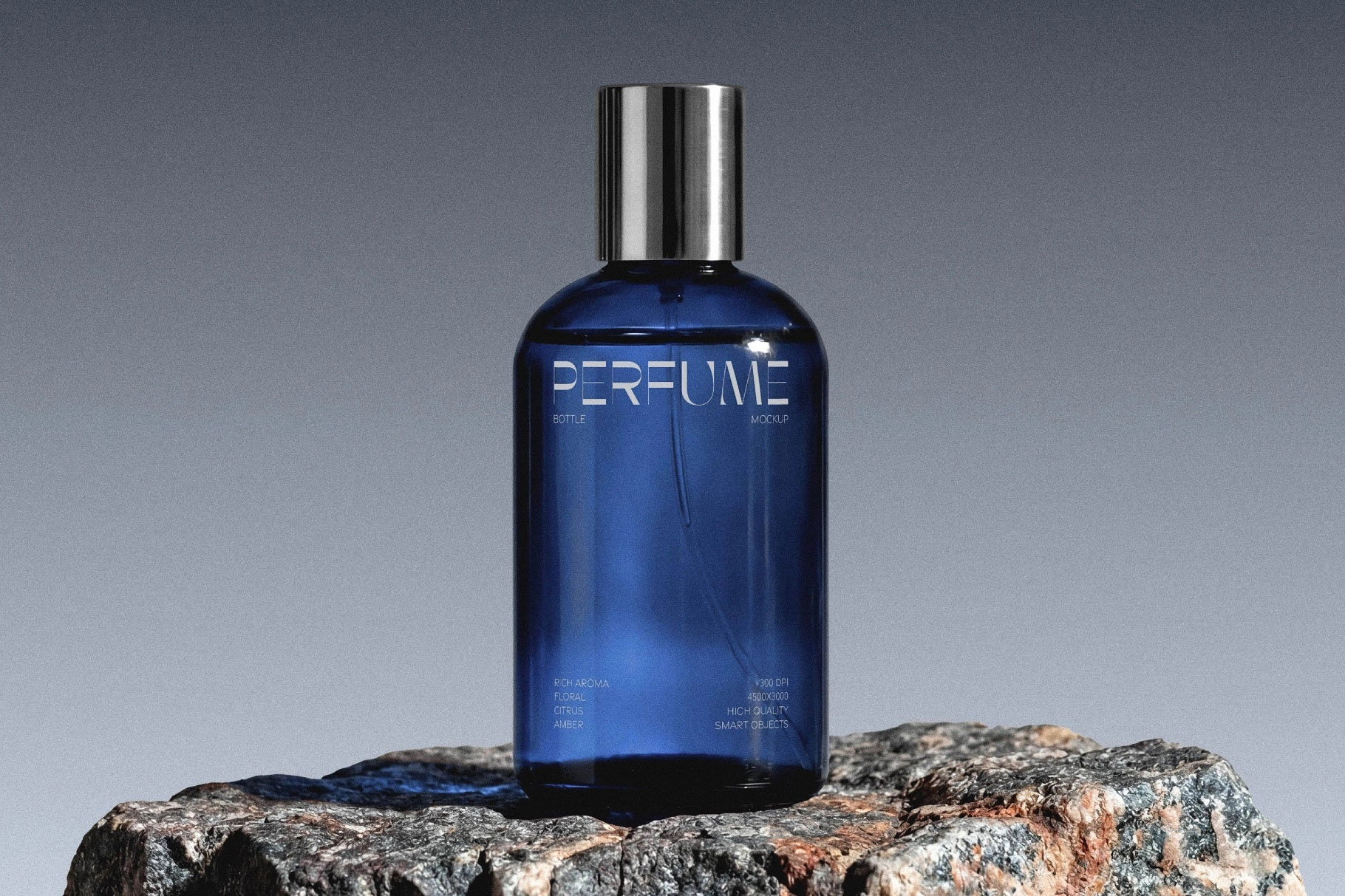 Free Glass Perfume Bottle Mockup on Stone PSD Template