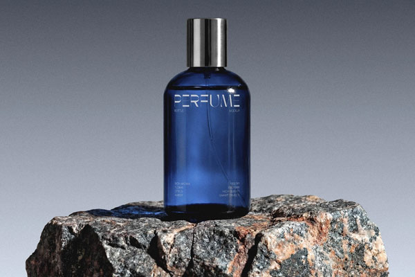 Free Glass Perfume Bottle Mockup on Stone PSD Template