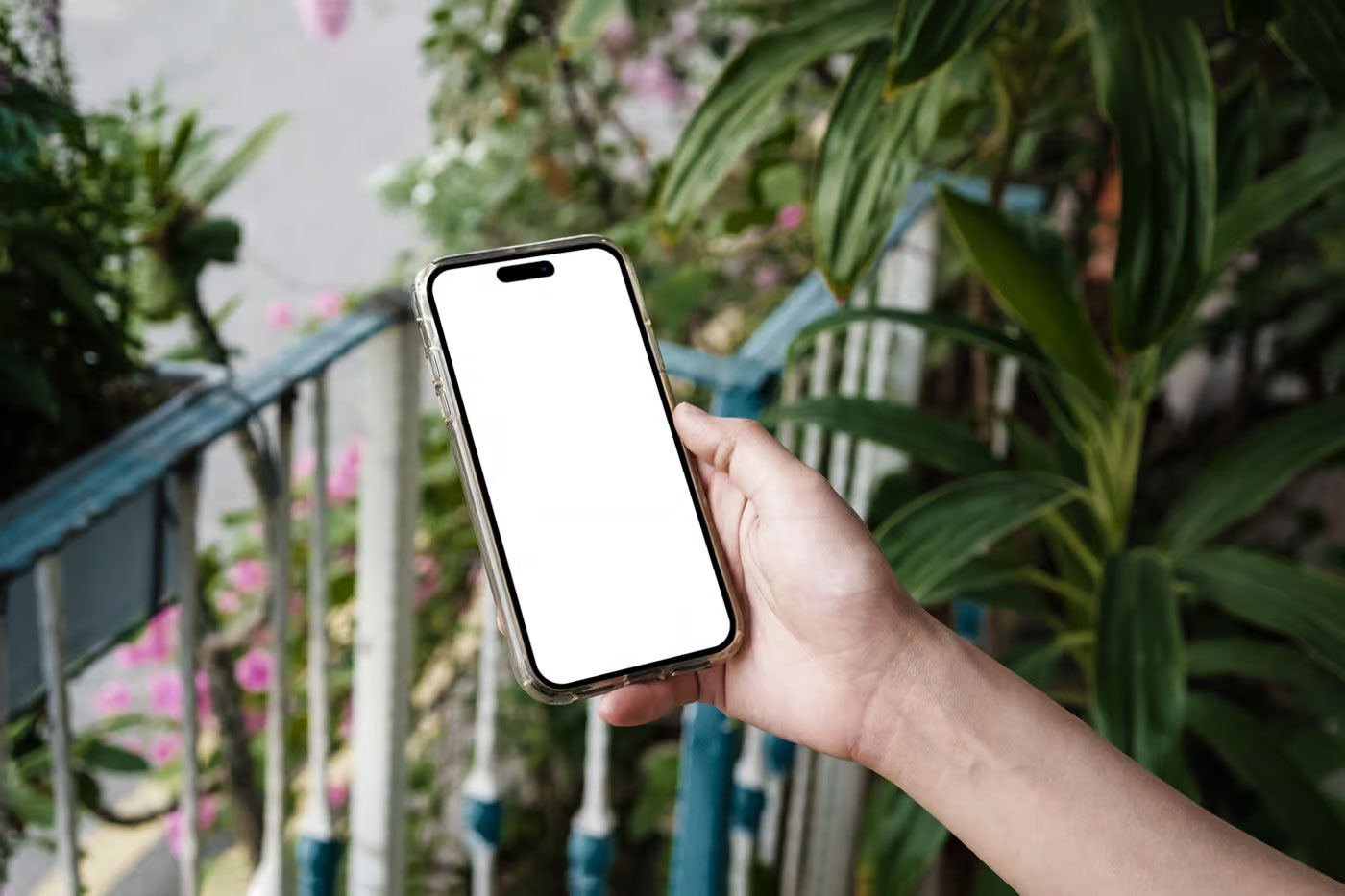 Free iPhone 16 Pro in Hand Mockup PSD Template