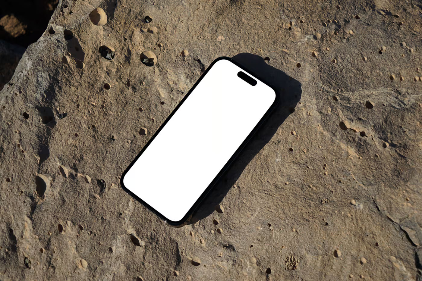 Free iPhone Pro on Rock Mockup PSD Template