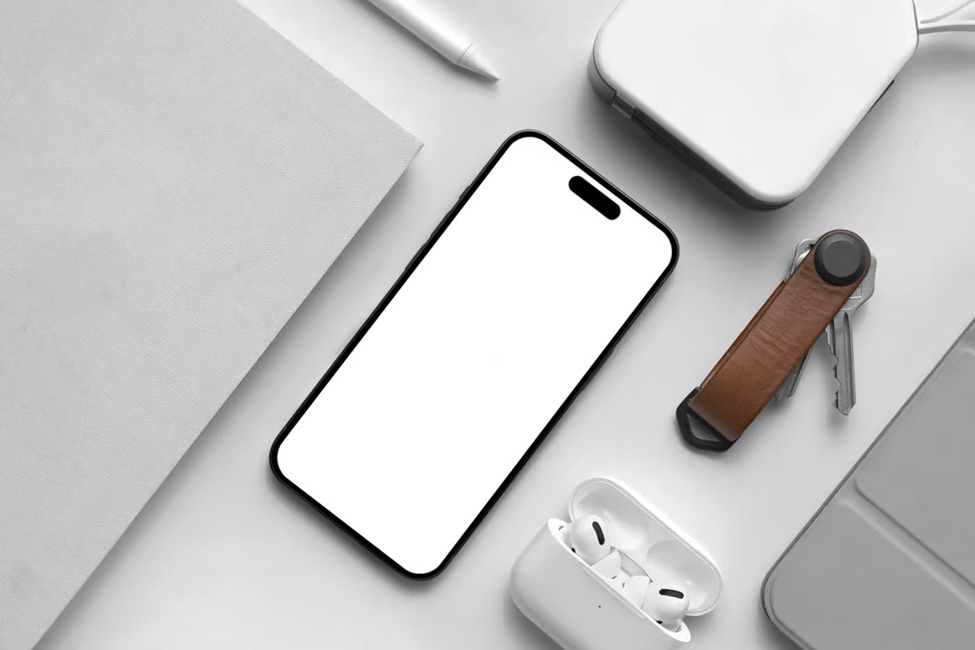 Free iPhone Pro with Book Mockup PSD Template