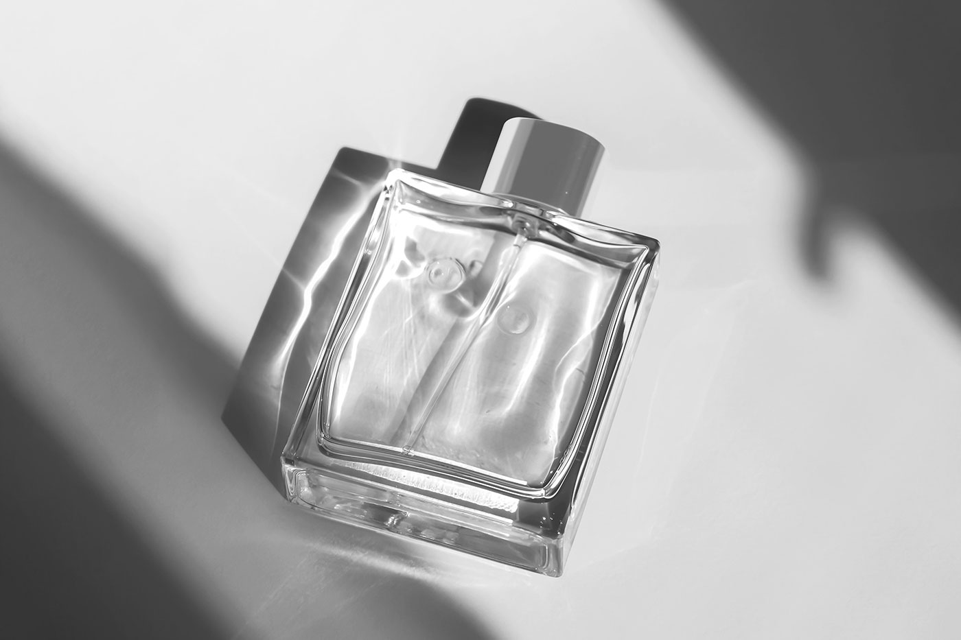 Free Lying Perfume Bottle Mockup PSD Template