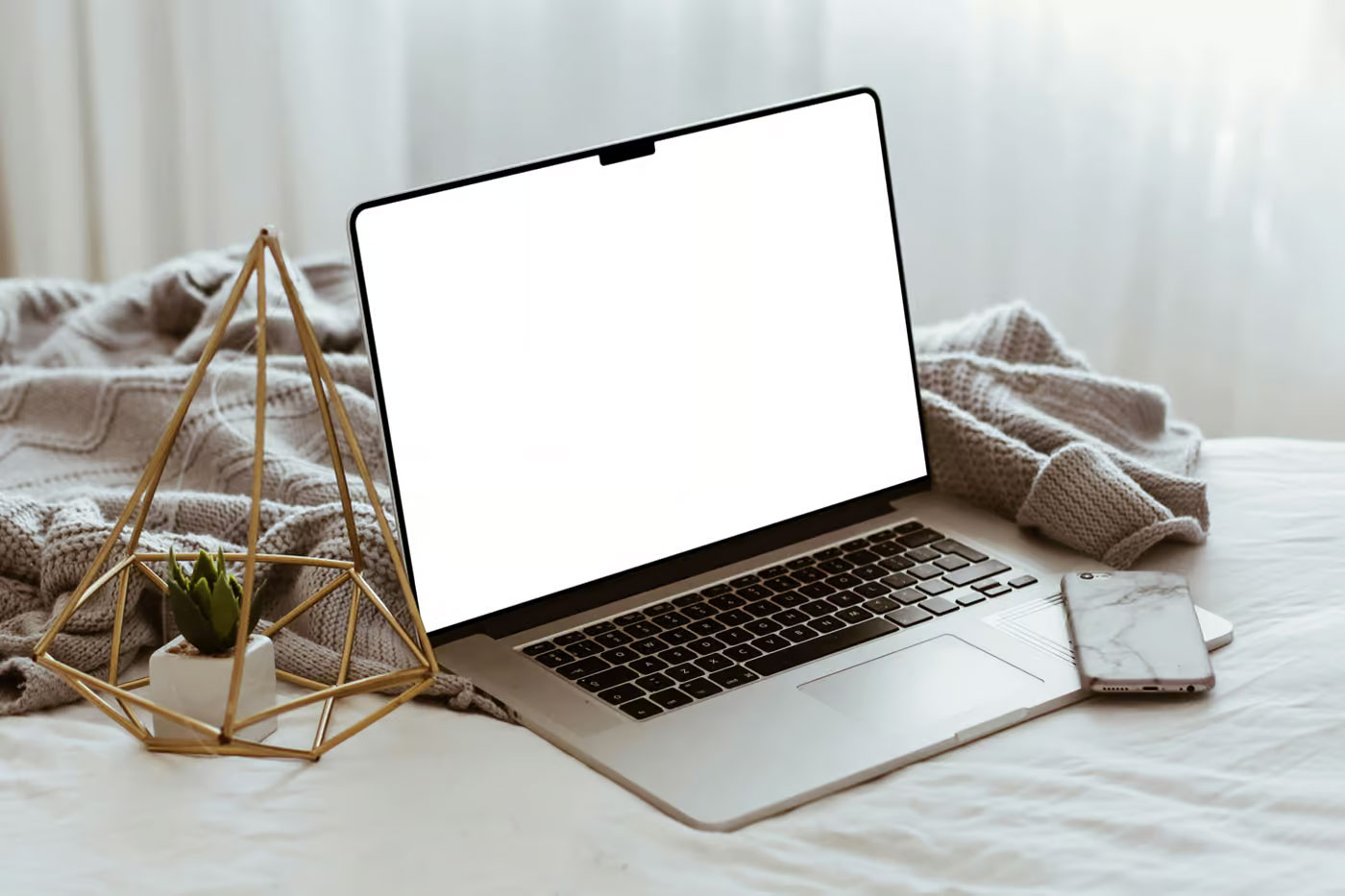 Free MacBook Pro Lying on Bed Mockup PSD Template