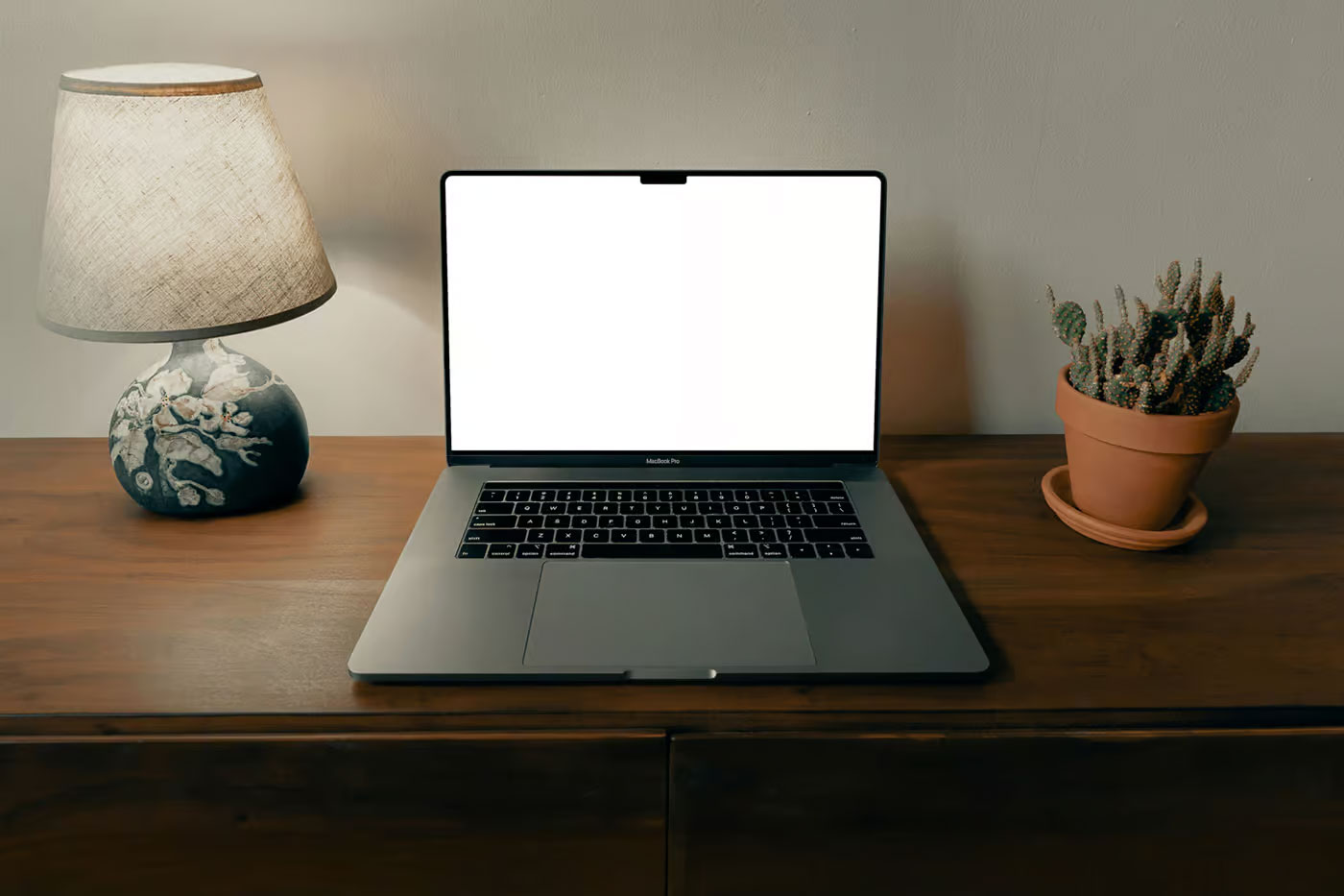 Free MacBook Pro on the Wooden Dresser Mockup PSD Template