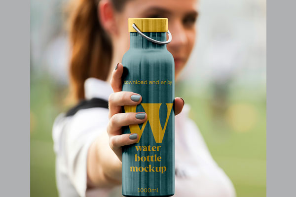 Free Metal Water Bottle in Hand Mockup PSD Template