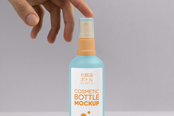 Free Spray Bottle with Hand Mockup PSD Template