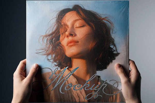 Free Vinyl Cover Mockup in Hand PSD Template