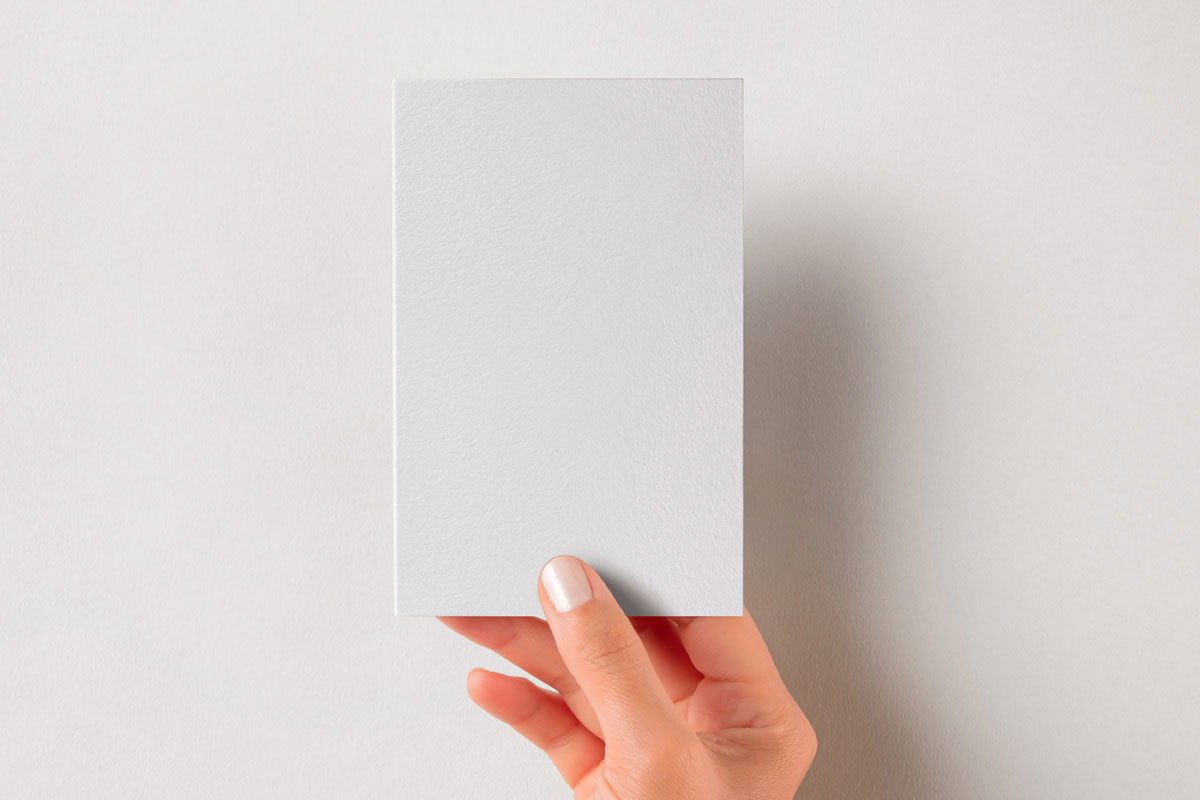 Free Hand Holding Vertical Brand Card Mockup PSD Template