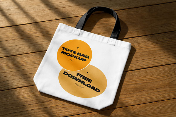 Free Tote Bag on Wooden Floor Mockup PSD Template