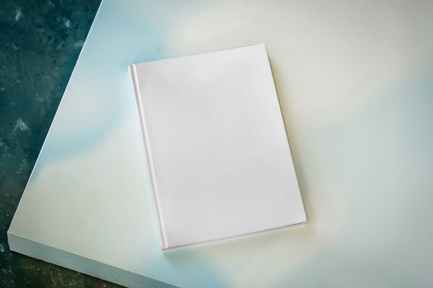 Free Book Cover on Table Mockup PSD Template