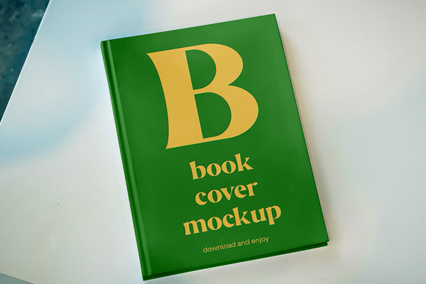 Free Book Cover on Table Mockup PSD Template
