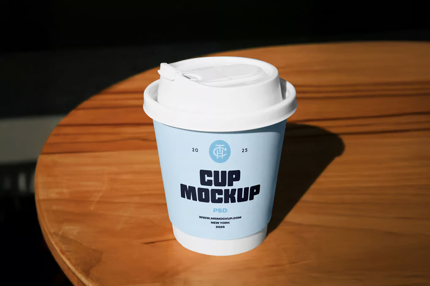 Free Coffe Cup on Table Mockup PSD Template