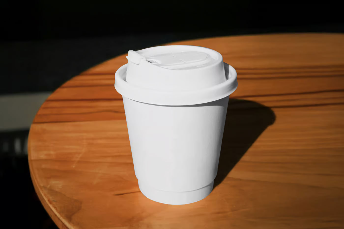 Free Coffe Cup on Table Mockup PSD Template