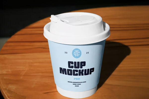 Free Coffe Cup on Table Mockup PSD Template
