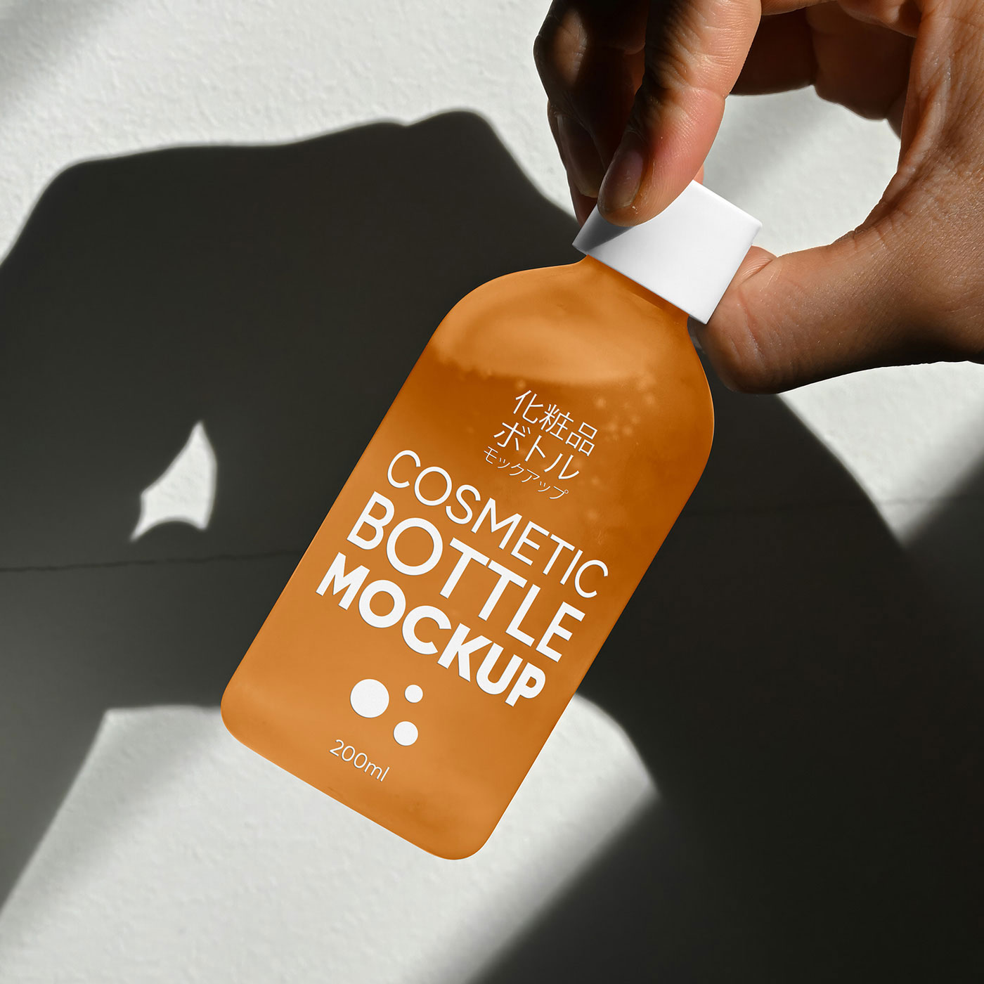 Free Cosmetic Glass Bottle in Hand Mockup PSD Template
