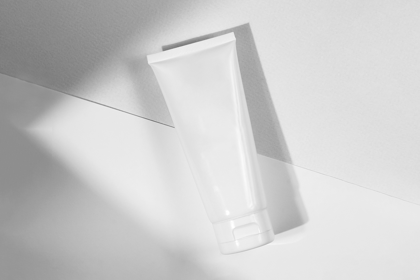 Free Cosmetic Tube Lying Mockup PSD Template