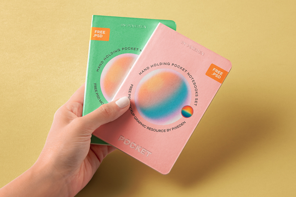 Free Hand Holding Pocket Notebooks Mockup PSD Template