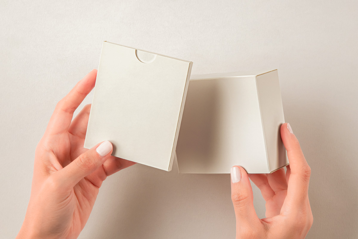 Free Hands Holding Boxes Set Mockup PSD Template