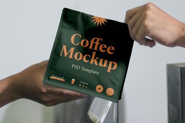 Free Hands Holding Coffee Bag Mockup PSD Template