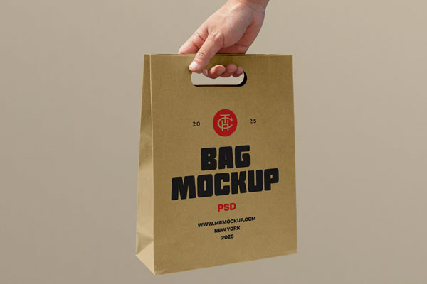 Free Holding Craft Paper Bag Mockup PSD Template