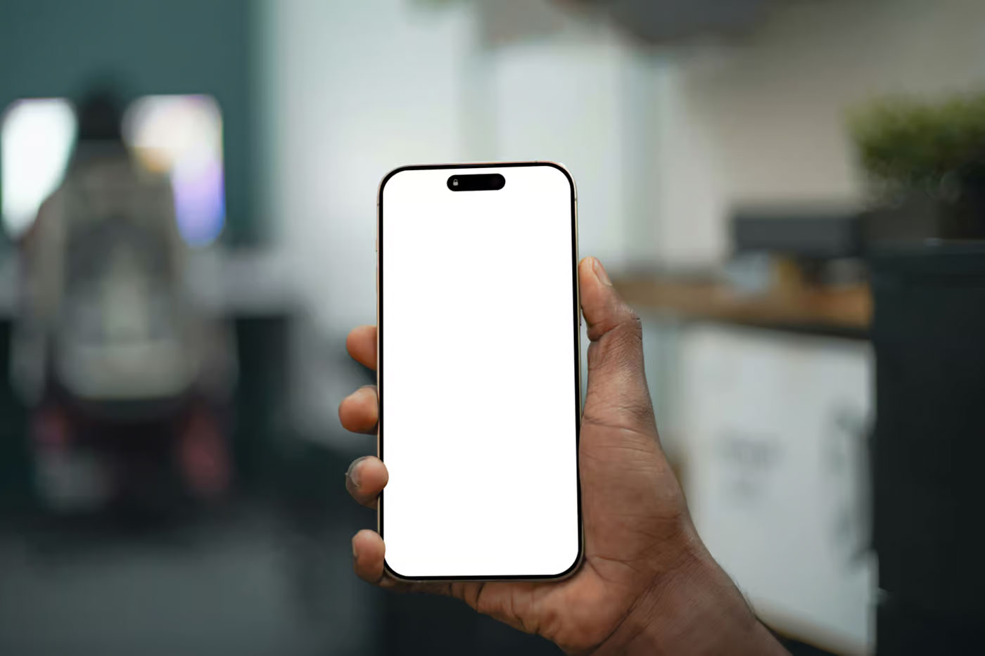 Free In Hand iPhone 16 Pro Mockup PSD Template