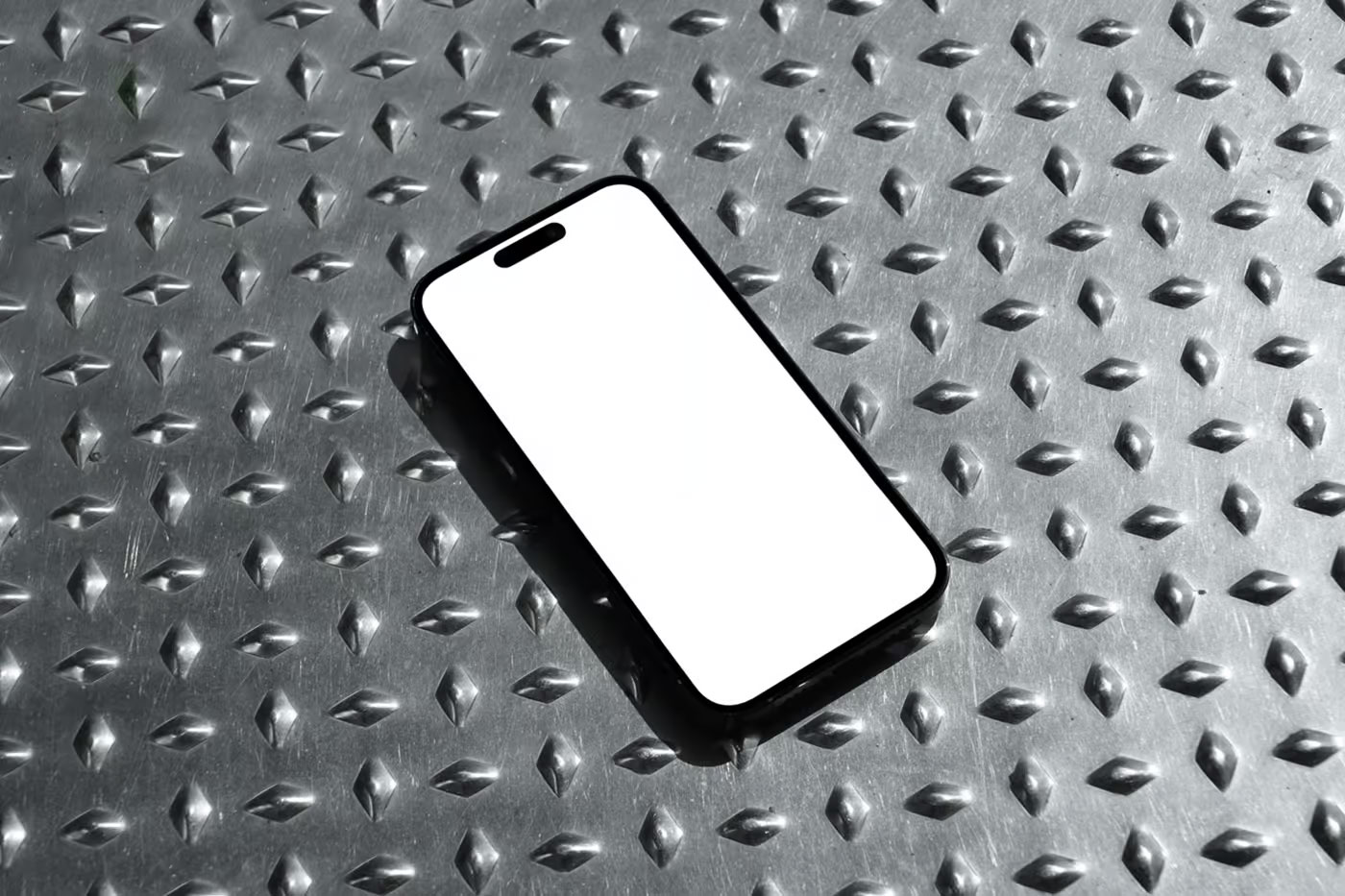 Free iPhone Pro on Metal Floor Mockup PSD Template