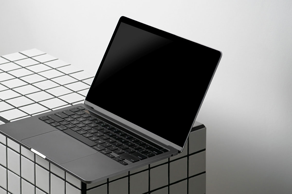 Free MacBook Pro Showcase Scene Mockup PSD Template