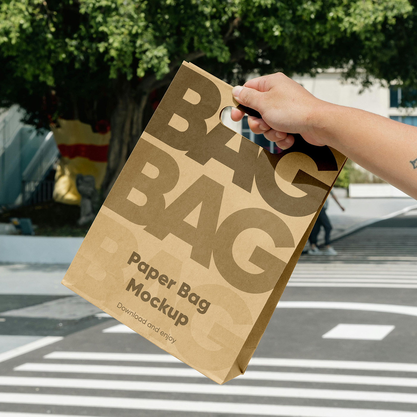 Free Paper Bag in Hand Mockup PSD Template
