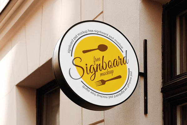 Free Round Sign Mockup on European Coffee Shop PSD Template