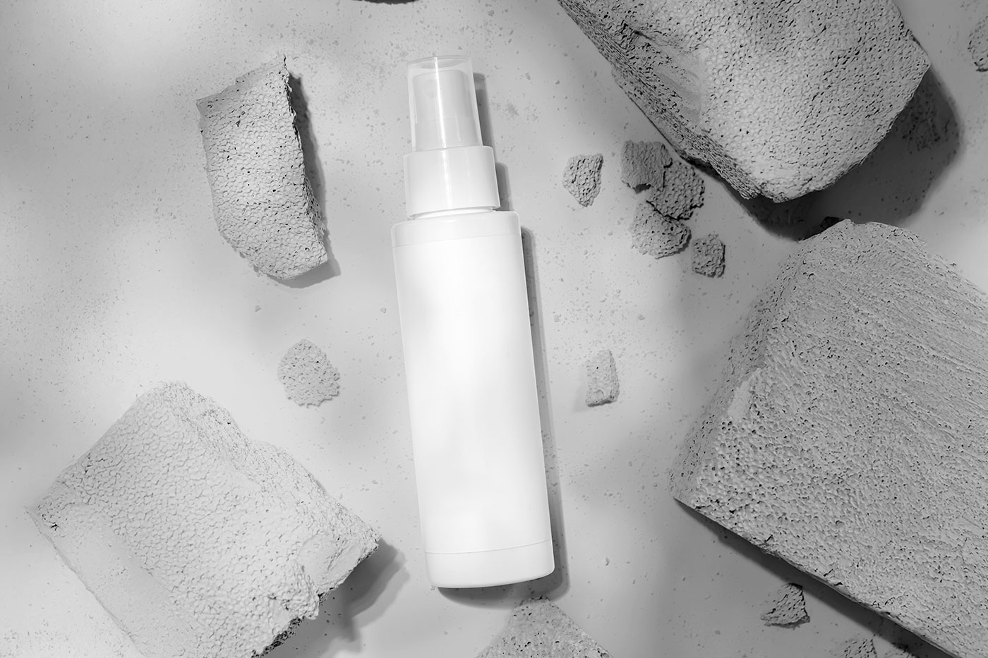 Free Sticker Label Cosmetic Bottle Mockup PSD Template