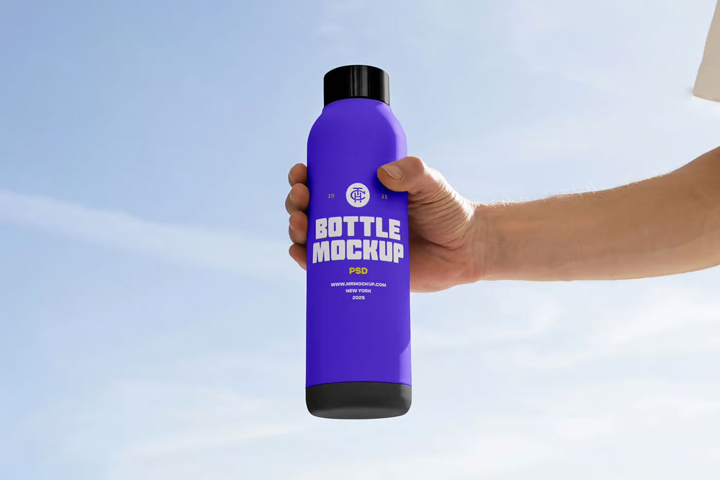 Free Tall Bottle in Hand Mockup PSD Template