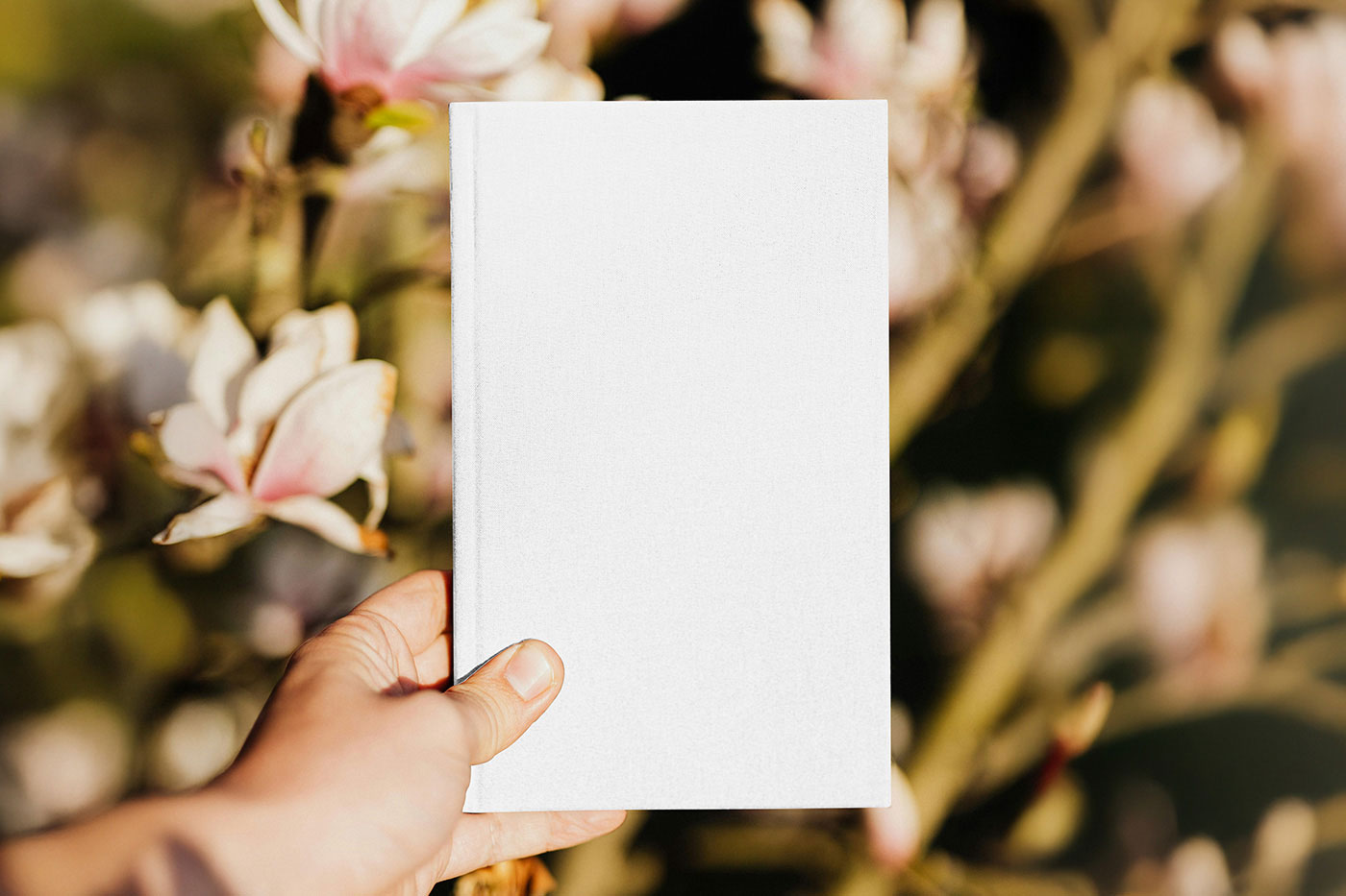 Free Vertical Book in Hand Mockup PSD Template