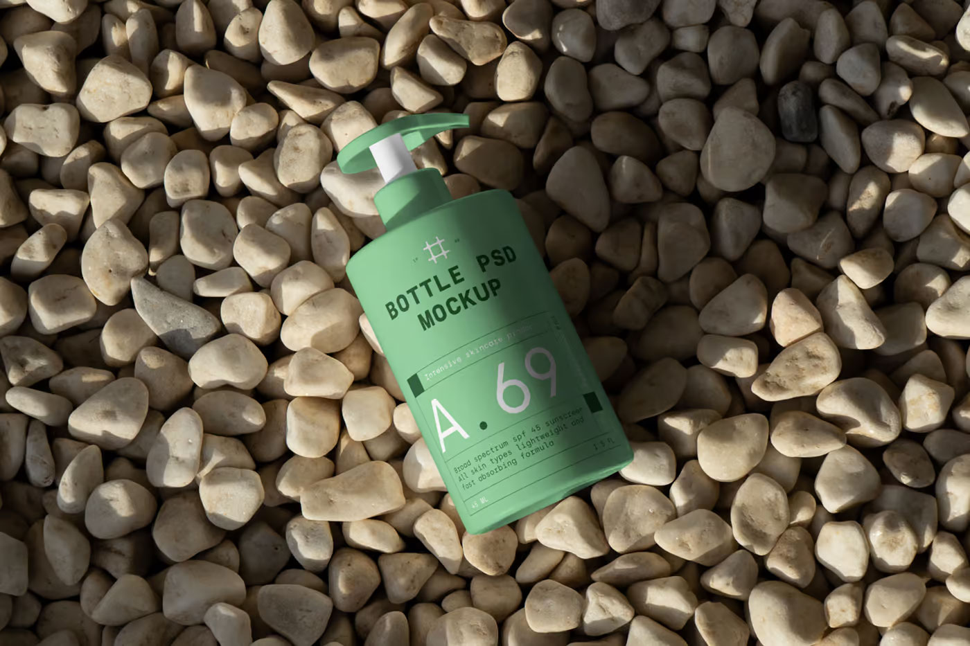Free Cosmetic Bottle on Beach Mockup PSD Template