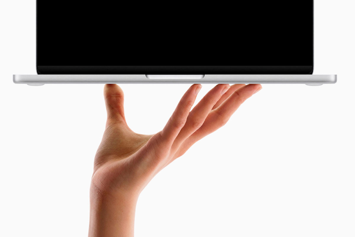 Free Hand Held MacBook Neo Mockup PSD Template