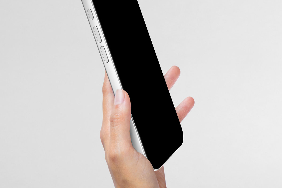 Free Hand Holding iPhone 17 Mockup PSD Template