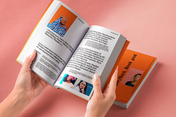 Free Hands Holding Open Paperback Book Mockup PSD Template