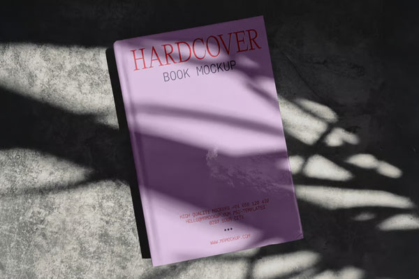 Free Hardcover Book on Concrete Mockup PSD Template