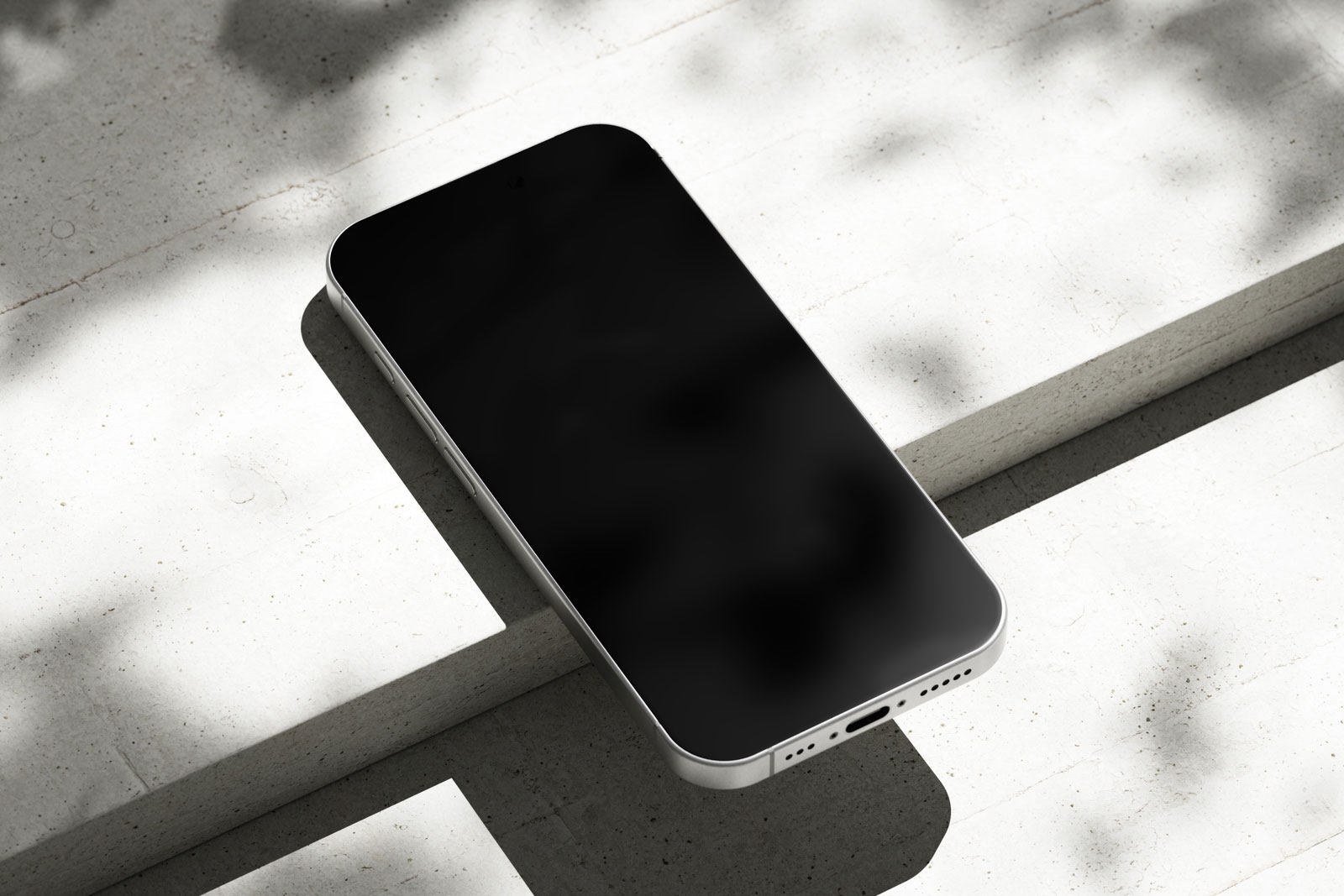 Free iPhone 16 Pro Mockup on Concrete PSD Template