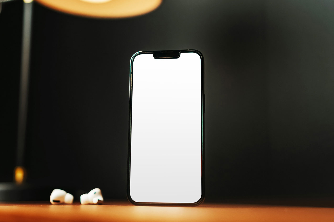 Free iPhone Standing on Desk Mockup PSD Template