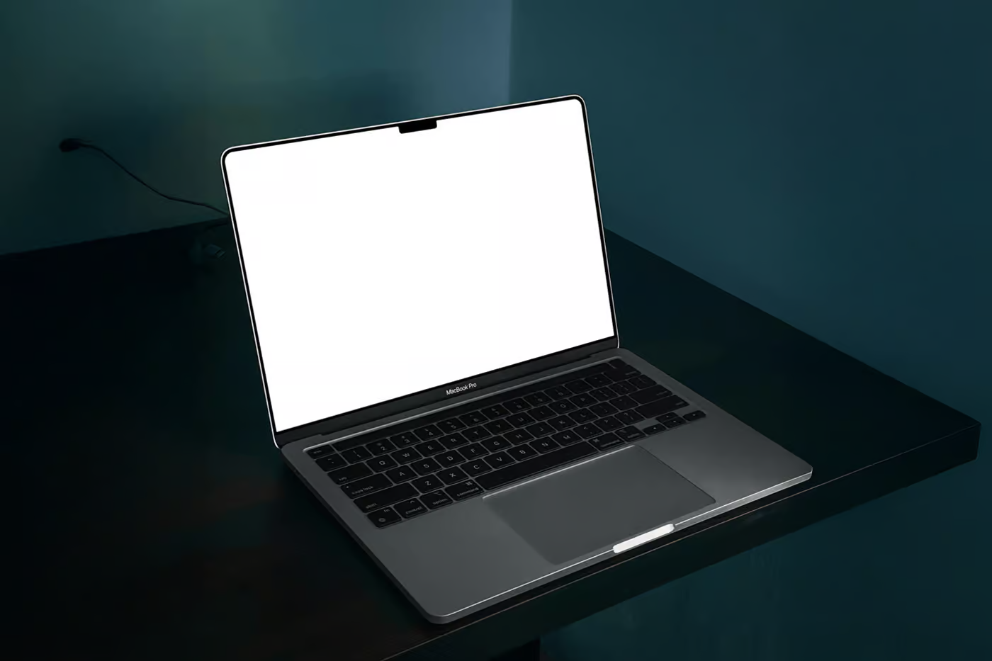 Free MacBook Pro on Black Table Mockup PSD Template