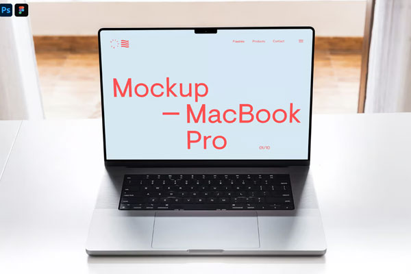 Free MacBook Pro on White Table Mockup PSD Template