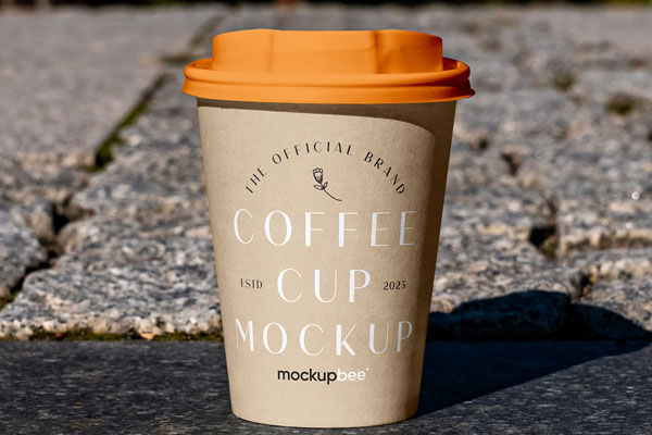Free Paper Cup on Sidewalk Mockup PSD Template