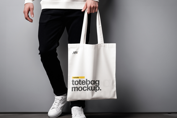 Free Tote Bag Mockup Holding by Hand PSD Template