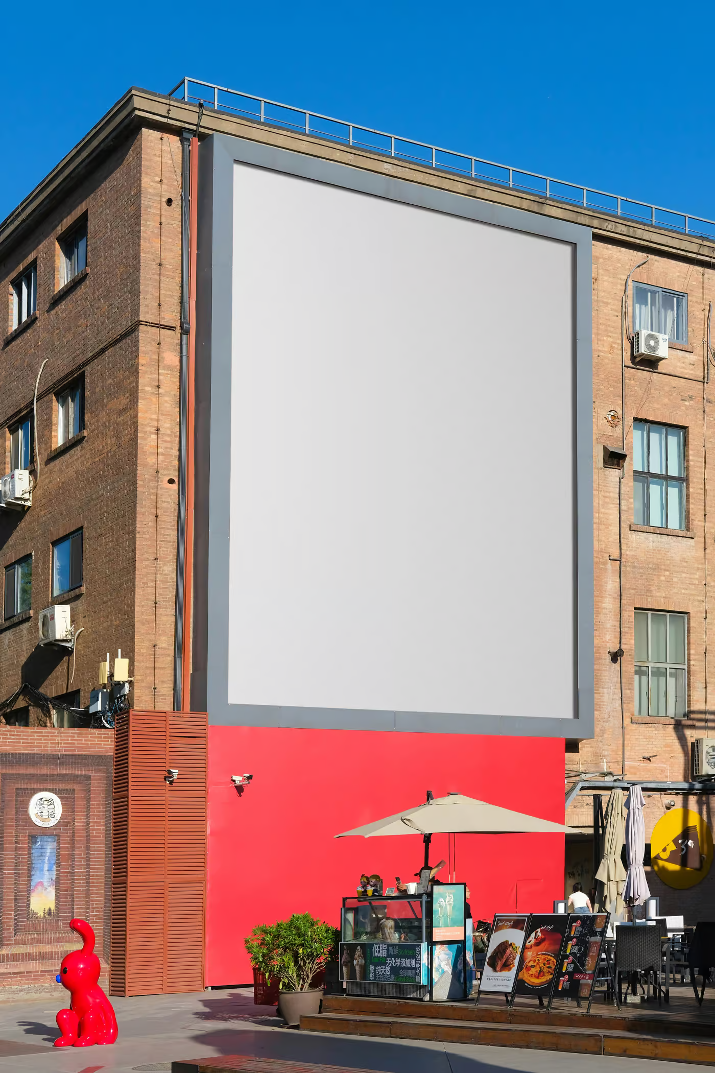 Free Vertical Billboard on Brick Building Mockup PSD Template