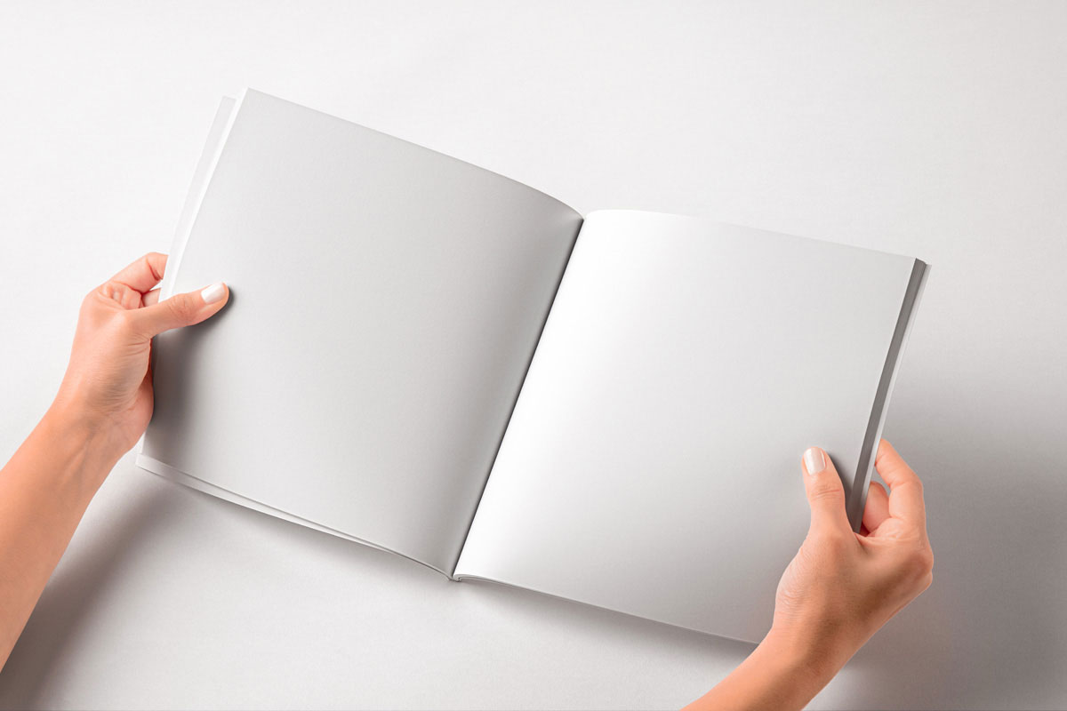 Free Hand Holding Square Catalog Mockup PSD Template