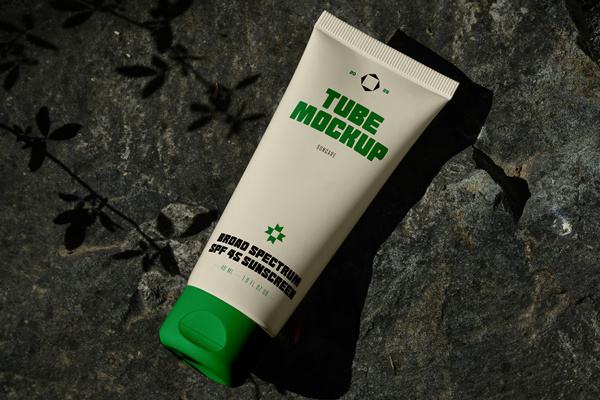 Free Lying on Rock Cosmetic Tube Mockup PSD Template